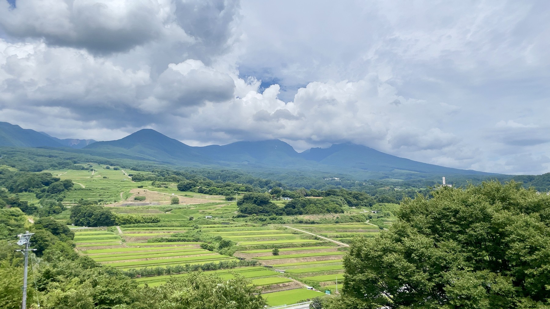Grassland and the summer landscape of the Asama foothills, seen from Komoro's nature trail